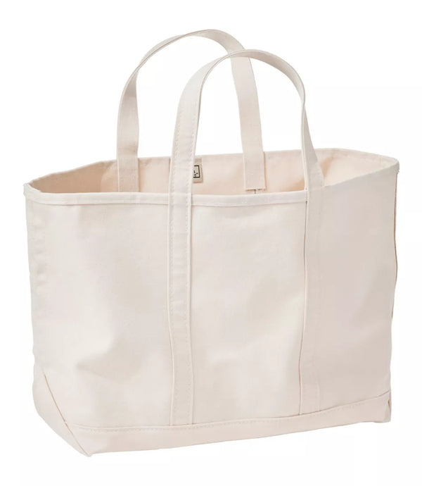 An off-white canvas tote bag with dual shoulder straps, shown against a plain white background.