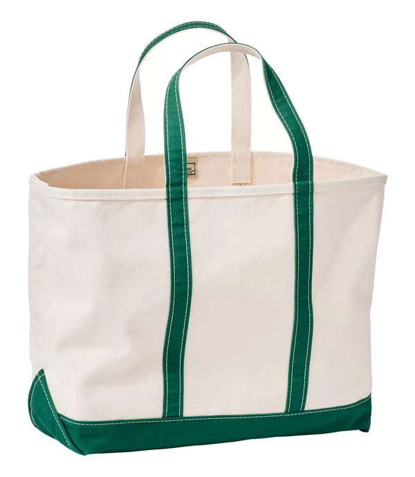 A canvas tote bag with an off-white body, dark green handles, and a dark green bottom panel, shown on a plain white background.