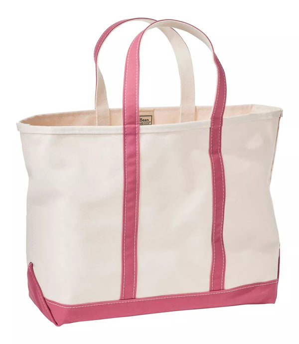 A cream canvas tote bag with pink trim, double shoulder straps, and a pink bottom base, shown on a plain white background.